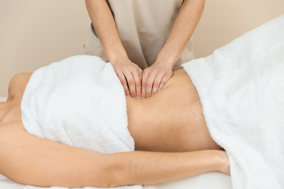 A Therapist Giving Abdominal Massage in Female Patient